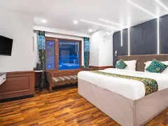 Bright modern bedroom with warm wood flooring.