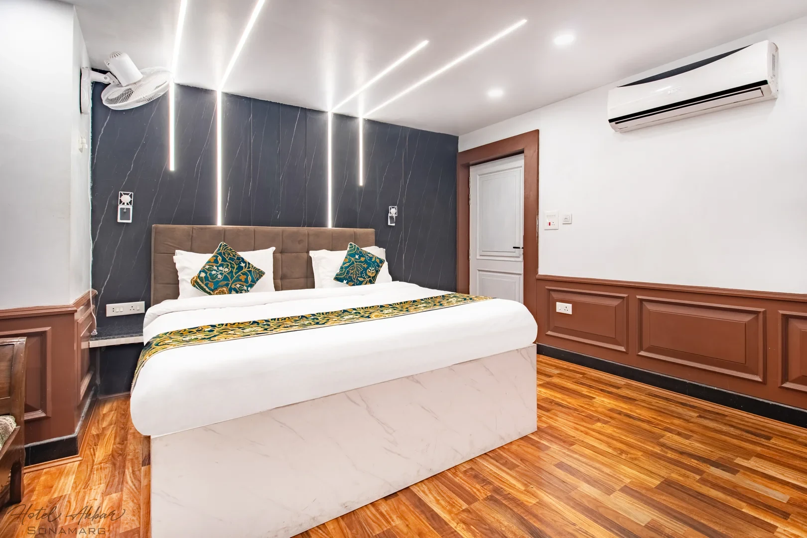 Luxurious Sonamarg hotel bedroom interior design.
