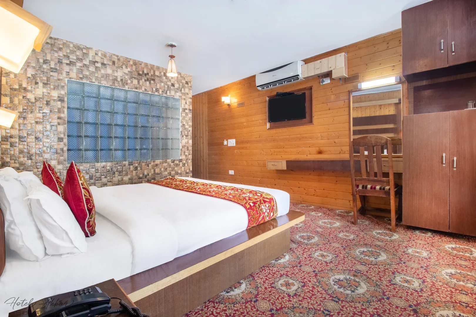 Luxurious Sonamarg hotel bedroom suite decor.