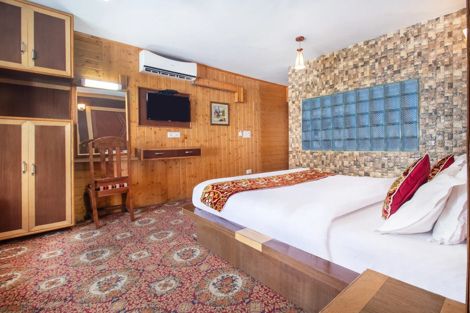 Luxurious Sonamarg hotel room interior design view.